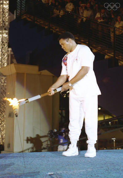 https://www.olympic.org/photos/19-jul-1996-muhammad-ali-holds-the-torch-before-lighting-the-olympic-flame-during-the-opening-cere